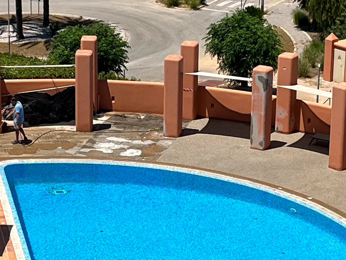 Finished resin-bound pool surround at an Algarve property
