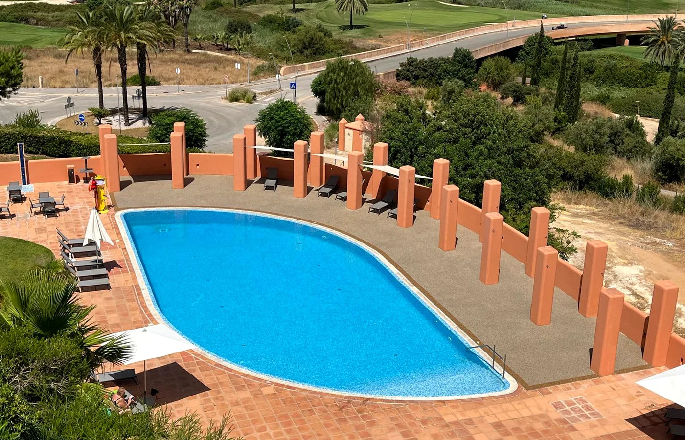 Completed Laranjeira pool deck overlooking an Algarve landscape